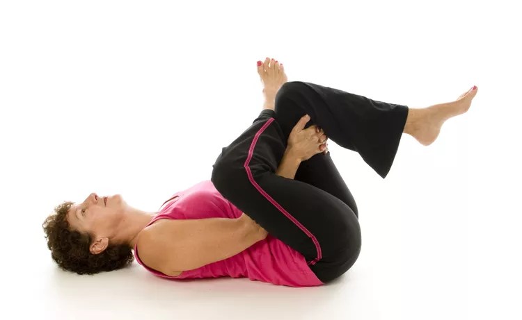 image of a women doing piriformis stretch for sciatica